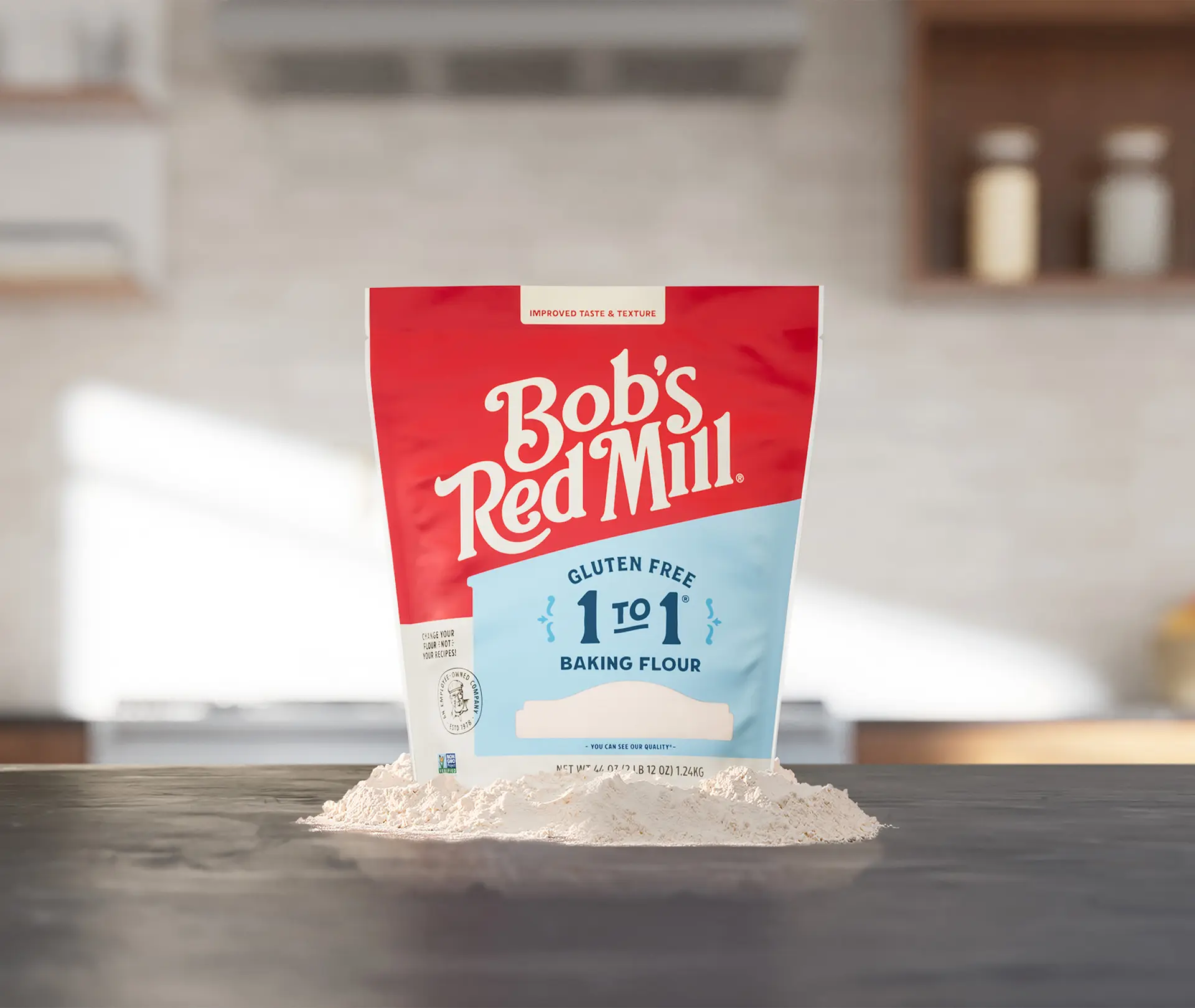 Bob's Red Mill Gluten Free 1-to-1 Baking Flour - front pouch on pile of flour
