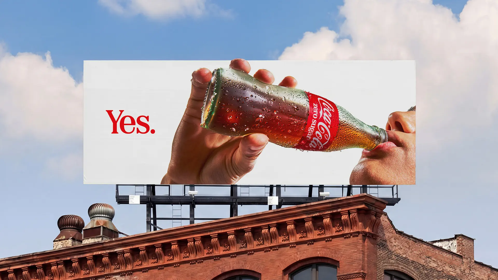 Coca-Cola billboard close-up: glass bottle with 'Yes.' copy