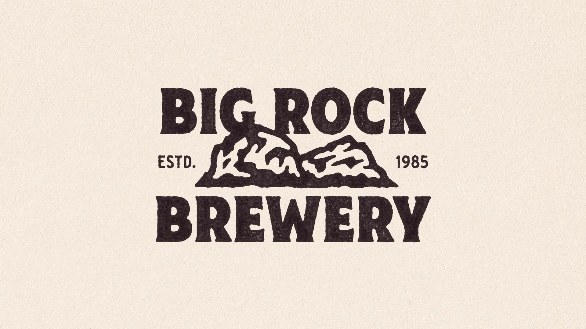 Big Rock Brewery logo — vintage stamped wordmark with rock illustration (ESTD. 1985)