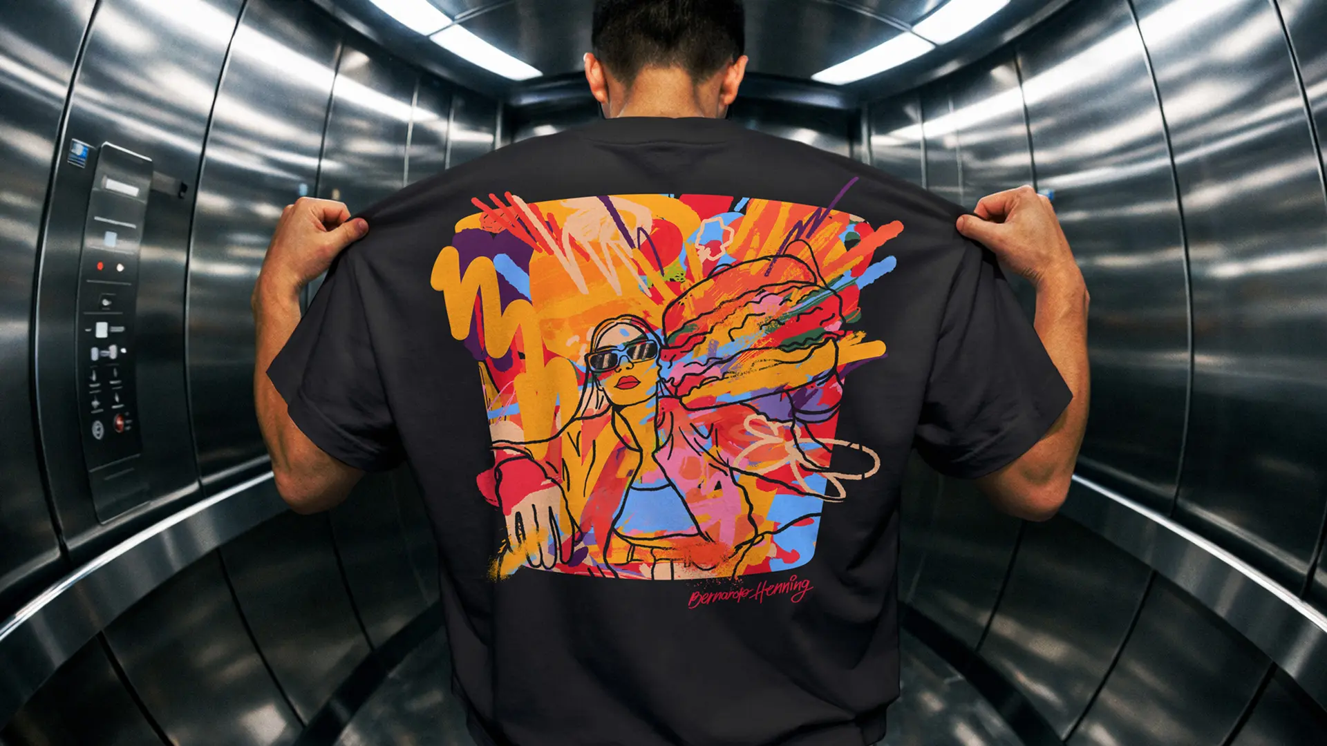 Black streetwear T‑shirt with neon pop‑art back print in mirrored elevator