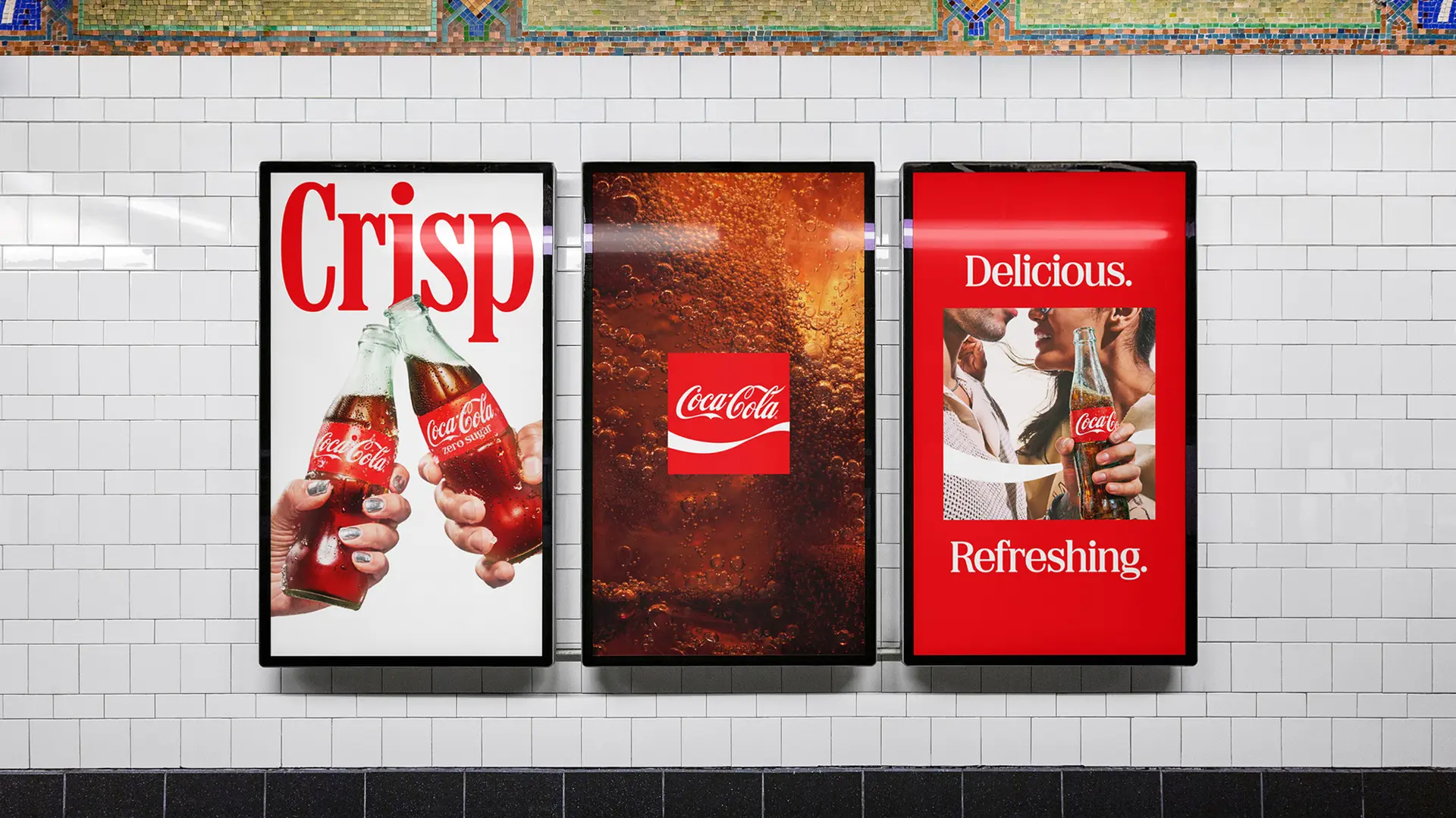 Coca‑Cola triptych posters on subway tile — "Crisp" / cola macro / "Delicious. Refreshing.