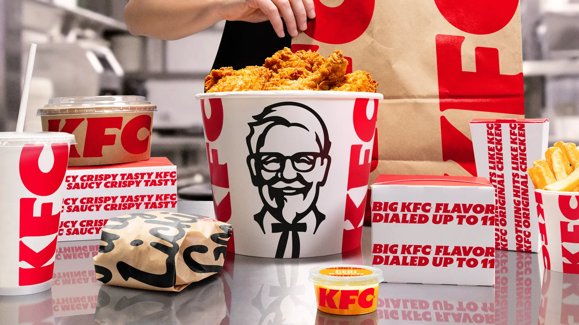 KFC branded meal spread with bold red-and-white packaging