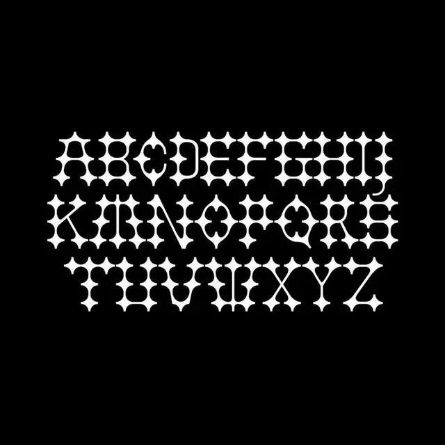 Ornamental stencil uppercase alphabet — white on black