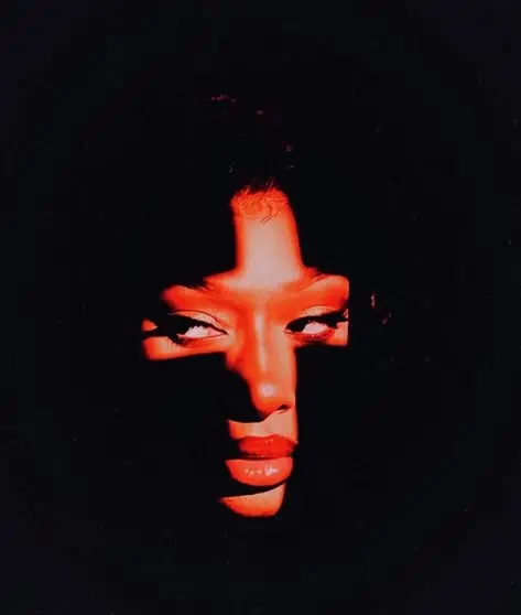 Red-gel close-up portrait with dramatic shadow