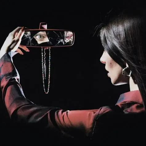 Profile Portrait Holding Cracked Rearview Mirror with Beaded Chain