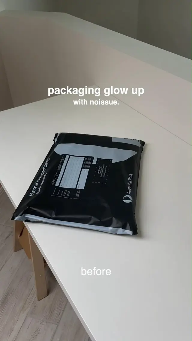 Black Australia Post poly mailer on white desk — "packaging glow up" story image