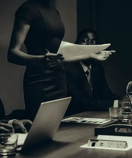 Boardroom Document Review — Sepia Photo of Executive Meeting