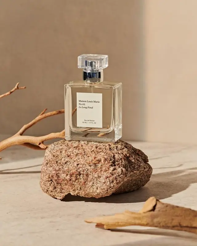 Maison Louis Marie No.02 perfume bottle on textured rock — River Mint Finery