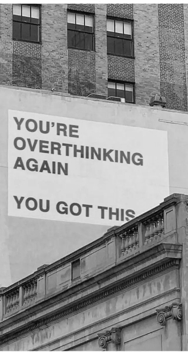 Billboard with motivational message on urban building facade