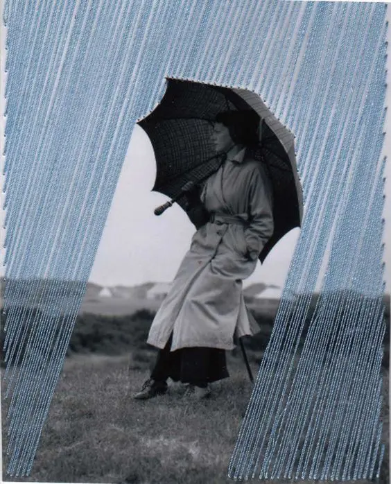 Vintage black-and-white photo with hand-stitched blue thread 'rain' overlay