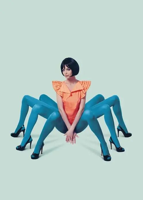 Surreal fashion editorial: orange shift dress with multiple turquoise-tights legs