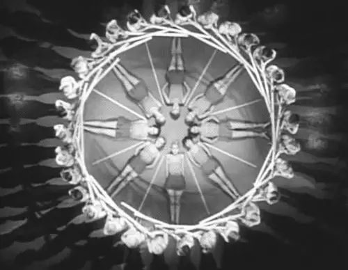 Vintage overhead film still — radial chorus formation of dancers