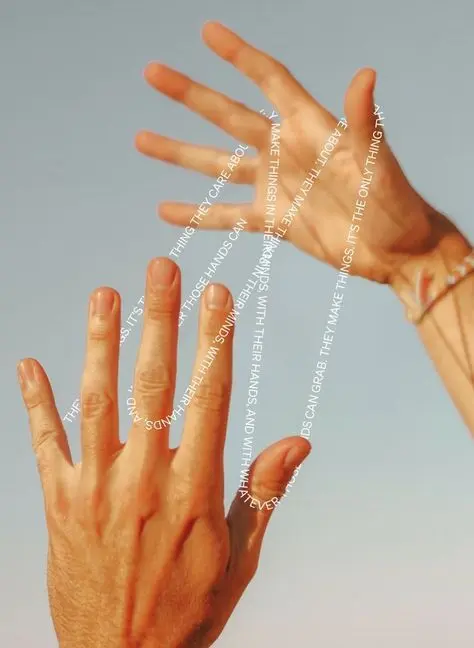 Two hands reaching against blue sky with vertical white typographic overlay