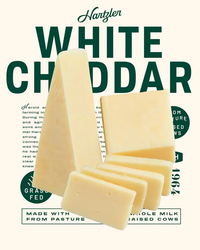 Hartzler White Cheddar — wedge and sliced cheese with bold green branding