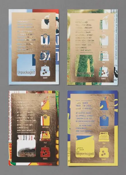 Four gold-foil posters promoting unpackaged grocery shopping