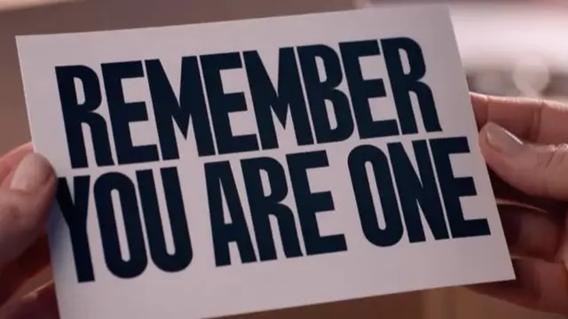 Bold typographic card: "REMEMBER YOU ARE ONE" held by hands