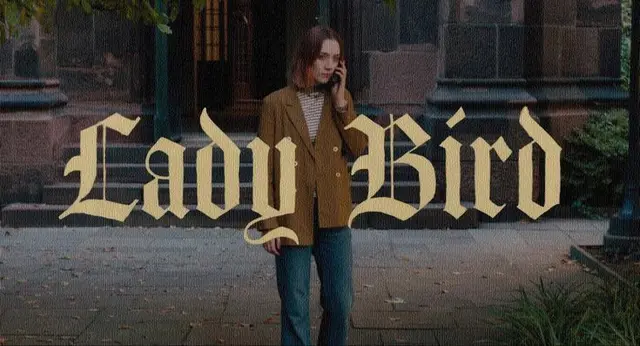 Lady Bird — film-style photo of young woman on brownstone stoop with gold blackletter logo