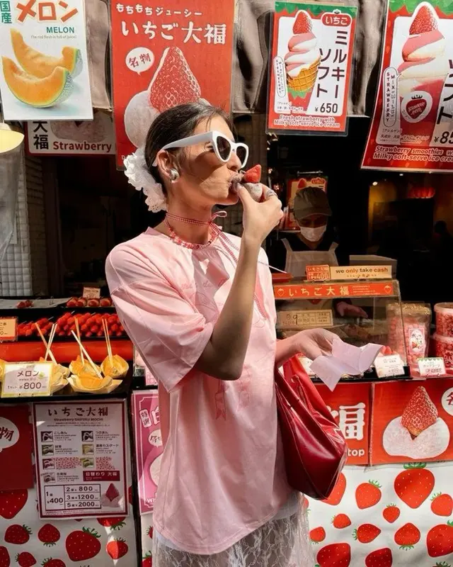Strawberry daifuku stall portrait — pink outfit, white sunglasses