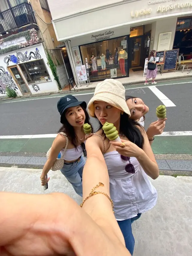 Friends selfie with matcha soft-serve outside Proportion Gallery, Omotesando