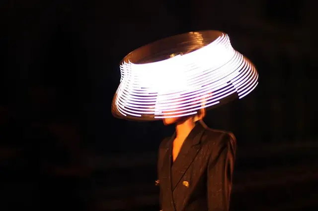 Moritz Waldemeyer — LED light‑painting performance in attic (Designboom interview)