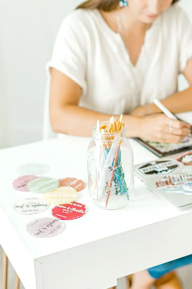 Richmond brand shoot — Honey Bee Crafts: pastel magnets and sticker-covered laptop on a白 (