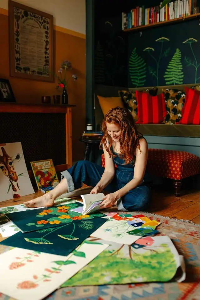 Cozy home studio with botanical illustration prints