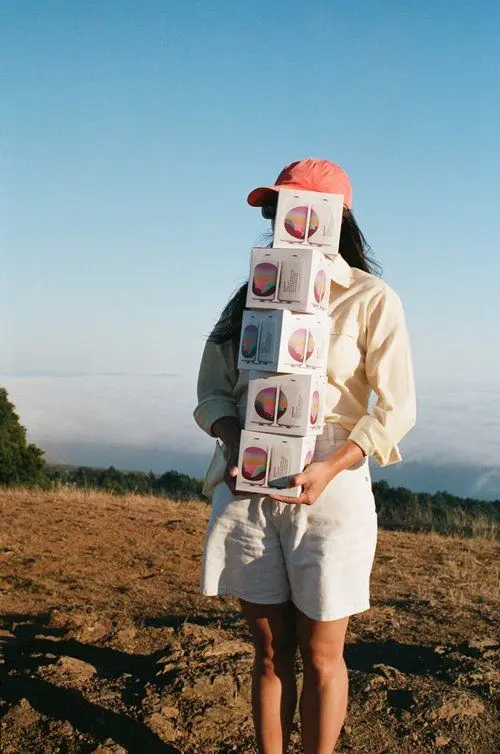 Moonland natural canned wine — beach product photo (35mm film)