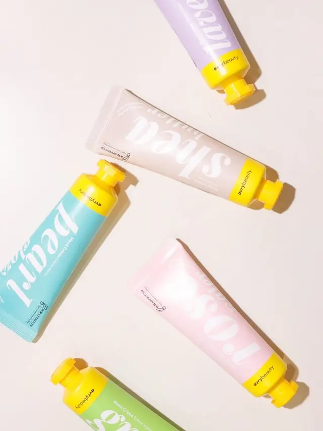 Heyday logo — serif wordmark with botanical sprig (Body & Hand Creams — Lavender Sage Hand