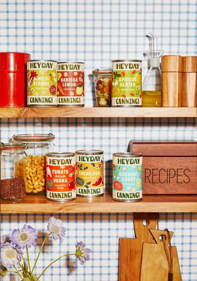Outline-designed Heyday canned beans — yellow enamel pot on gas stove