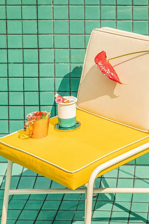 Poolside Still Life with Yellow Lounge Chair and Cocktails — Alejandro Osses