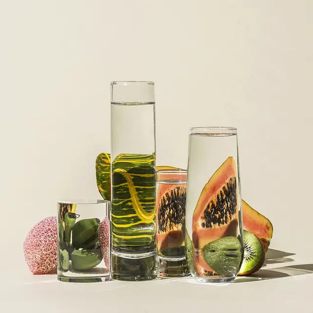 Suzanne Saroff — Fish segmented by drinking glasses (studio still life)