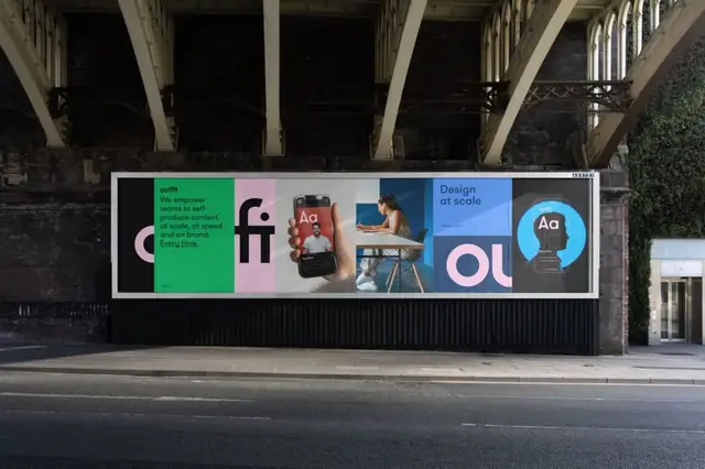 Outfit campaign billboard — Bigfish branding under railway viaduct