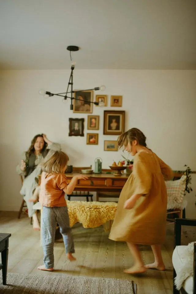 In‑home Family Session — candid motion, vintage mirror, tulips (Angela K Photography)