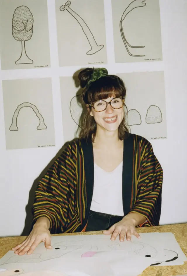 Eva Fàbregas — Side-profile portrait with pink cutout backdrop