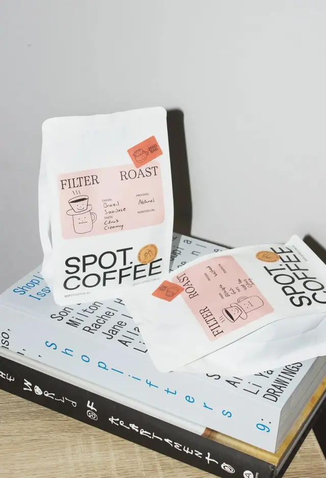 Spot Coffee — Filter Roast packaging on stacked books