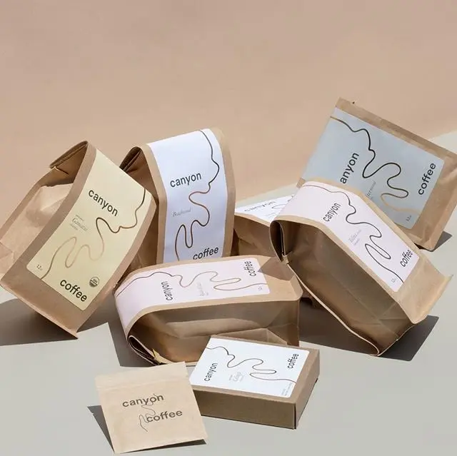 Canyon Coffee — Branded Ceramic Cup with Freshly Poured Coffee