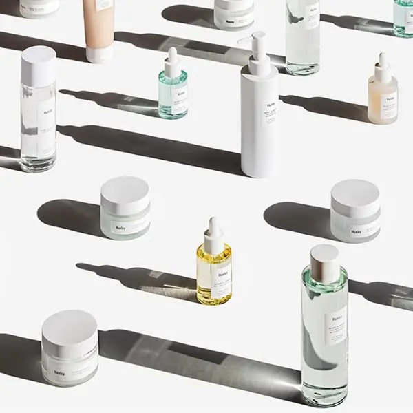 Glow Recipe product flat lay — jars, serums and toners