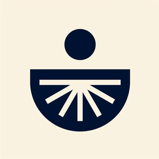 Chopra brand mark — navy sunburst semicircle logo (YouTube)