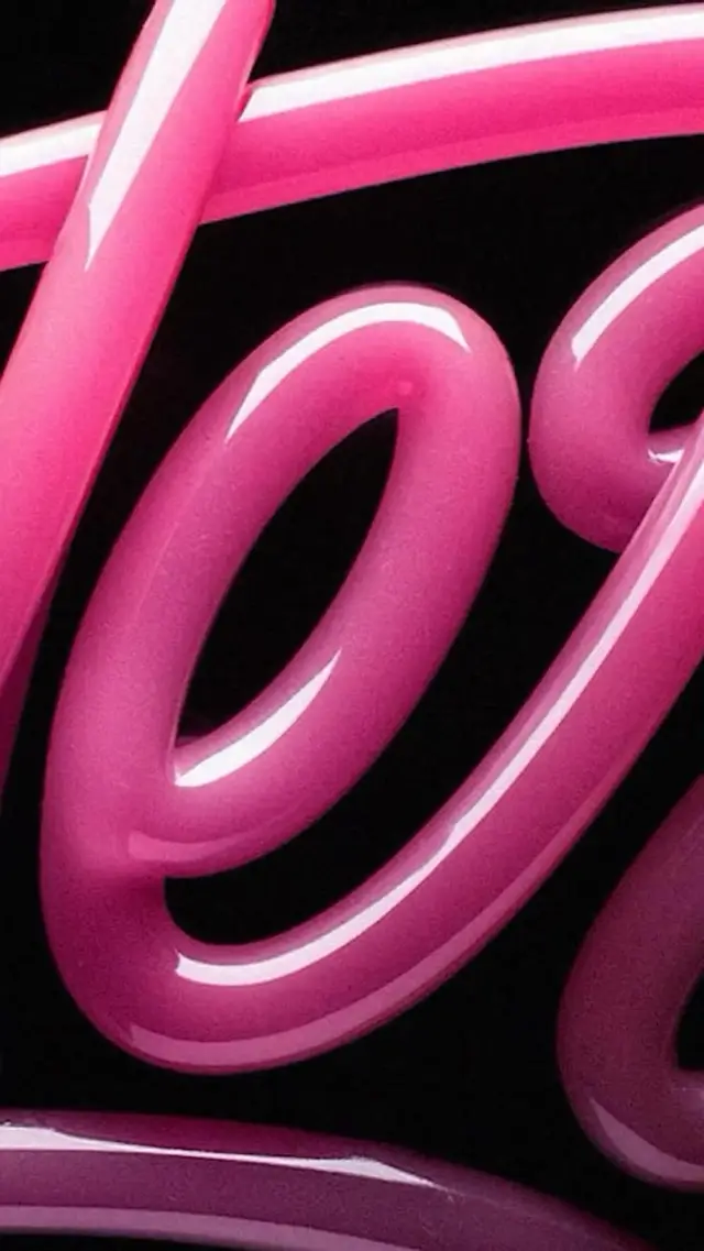 Close-up glossy pink 3D script lettering on black background