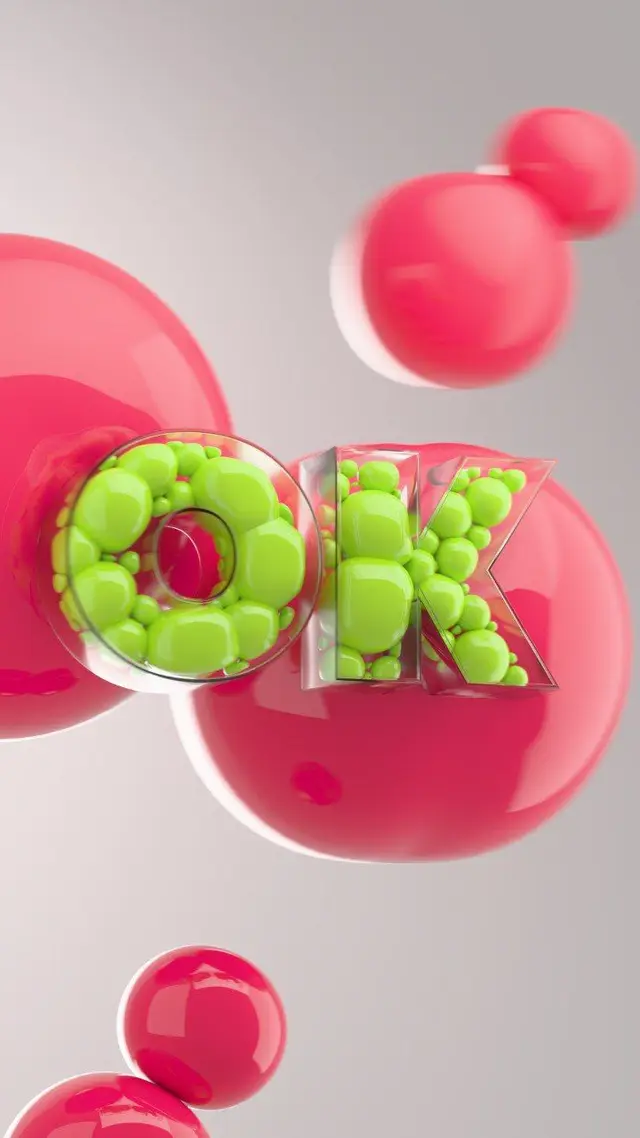Translucent "OK" Filled with Neon Pebbles Among Glossy Pink Bubbles
