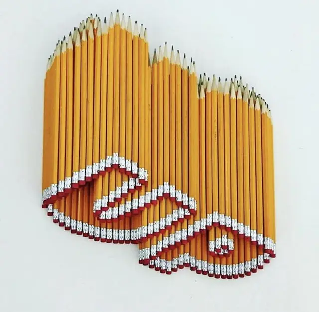 Wave-shaped arrangement of sharpened yellow pencils with red erasers