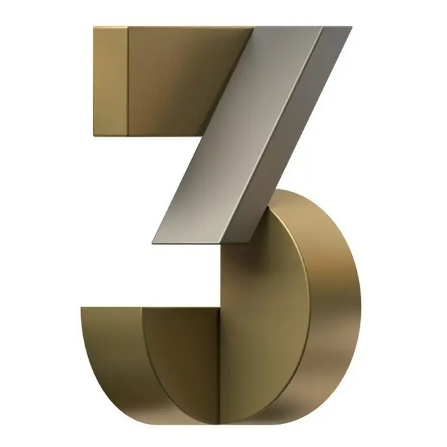3 — 3D metallic numeral in gold and brushed steel