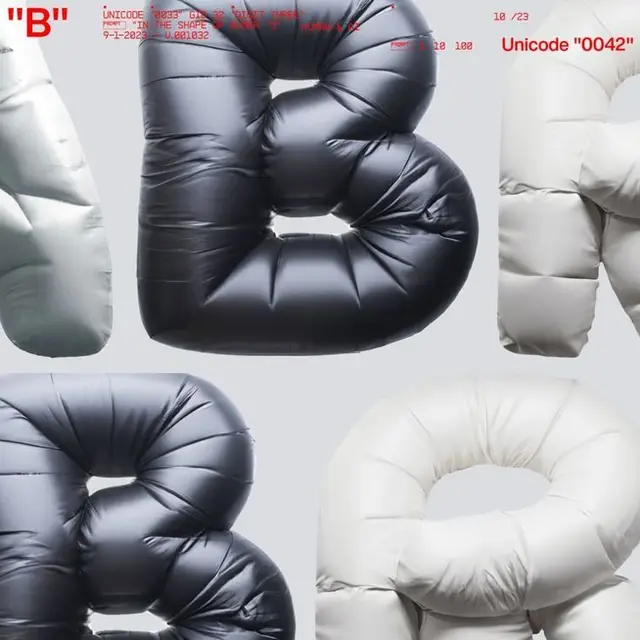 Inflated puffer letter B — black & white quilted typography study