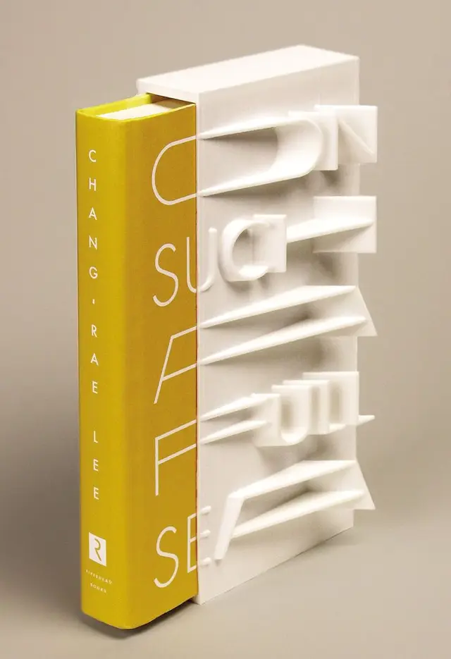 Yellow hardcover by CHANG·RAE LEE in white sculptural slatted sleeve