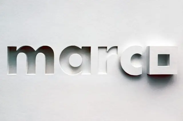 Paper-cut typographic wordmark "marc" with square glyph