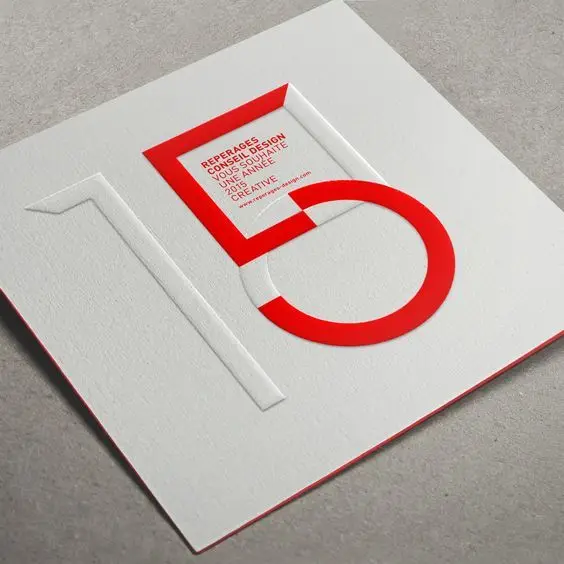 Minimalist embossed '15' anniversary card with red die-cut '5'