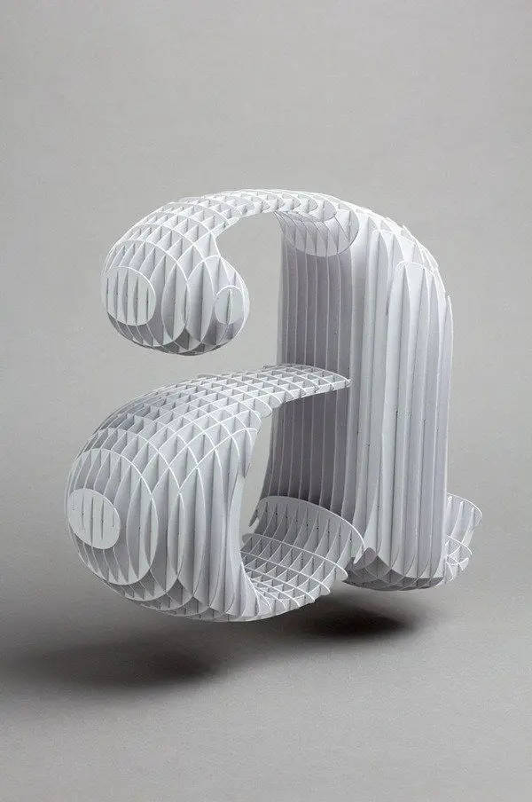 White paper honeycomb sculpture — 3D lowercase “a”