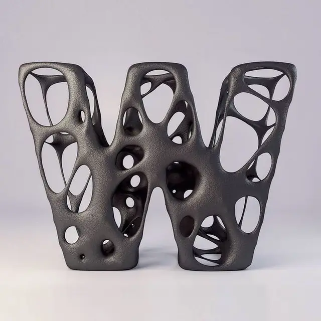 Porous matte-black sculptural letter W with organic lattice