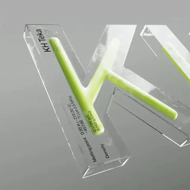 Transparent acrylic letter 'K' with embedded neon‑lime tube and printed scientific labels