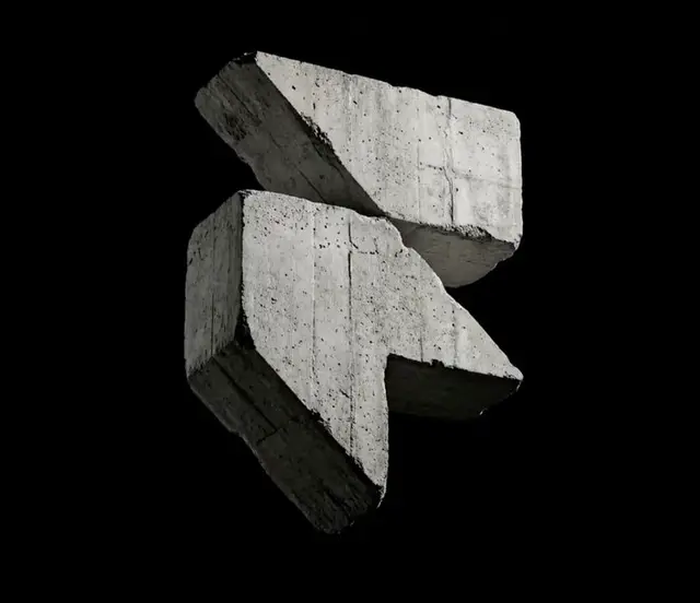 Angular cast-concrete fragments on black background